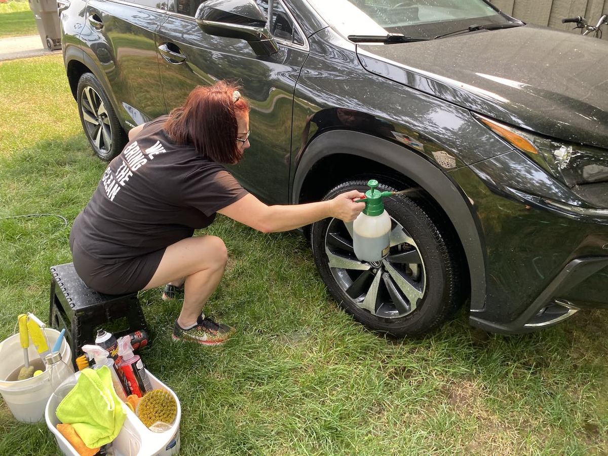Hand-applying tire shine by Black Rock Mobile Detailing in Sandpoint, Idaho