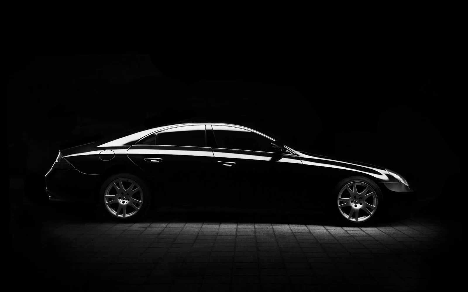 Glossy black car detailed to a deep mirror shine by Black Rock Mobile Detailing in Sandpoint, Idaho